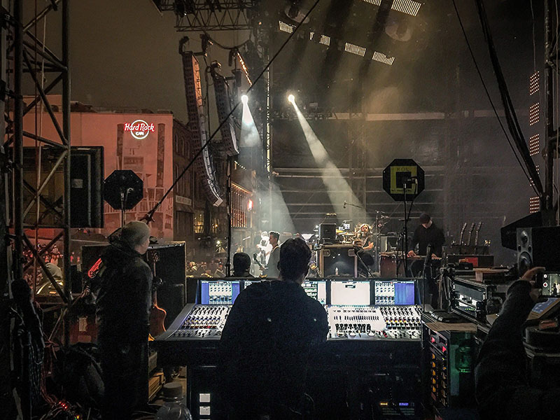 Saul Skoutarides mixing monitors for the Kings of Leon.
