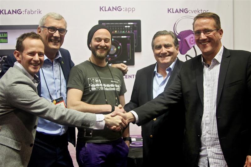 KLANG:technologies’ Pascal Dietrich (left) and Phil Kamp (center) shake hands with Group One Limited’s Jack Kelly (second from right) and Matt Larson (right)