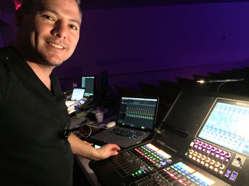 Vocalosity Technical Director and Front-of-House Engineer Tony Huerta, pictured with the Roland M-5000 OHRCA Live Mixing Console.
