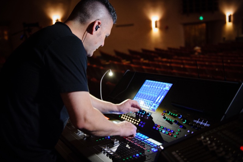 Vocalosity Technical Director and Front-of-House Engineer Tony Huerta, pictured with the Roland M-5000 OHRCA Live Mixing Console.