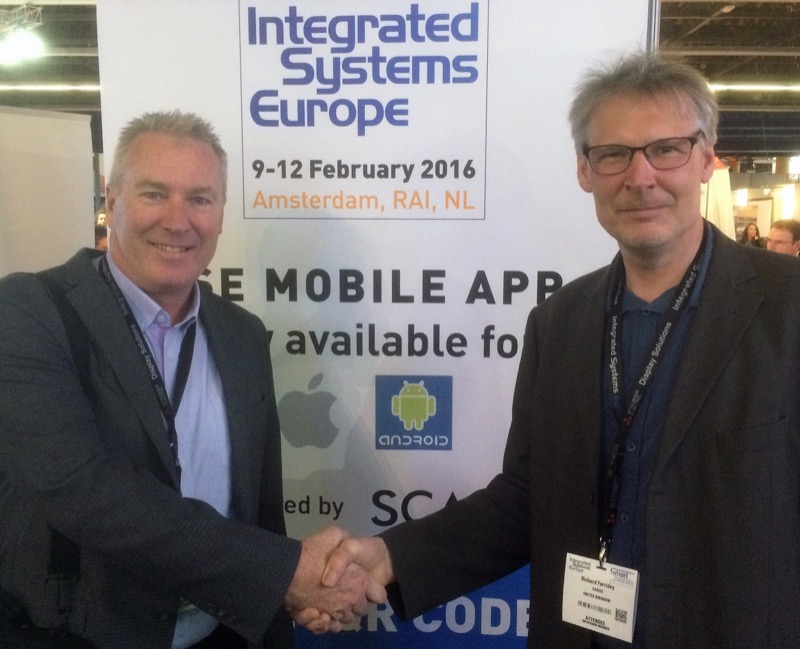 (L-R) Hills Consultant Support Manager Bryan Davidson with Cadac Director of Sales and Marketing Richard Ferriday sign the deal at ISE 2016