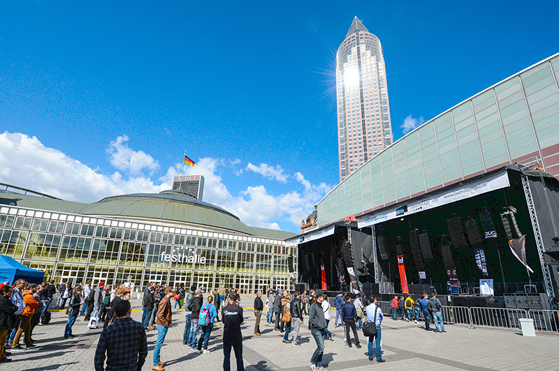 The open plaza between halls featured stages set up for outdoor line array demos.