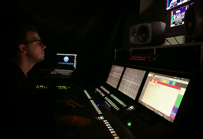 Sean Prickett, owner of Drop Ship Audio, works with the Calrec Summa audio console.