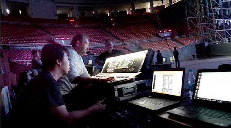 FOH Engineer Jim Ebdon (right) and Nan Hu, EAW brand manager for EZ Pro (left) fine tune the EAW Adaptive System before the tour begins.