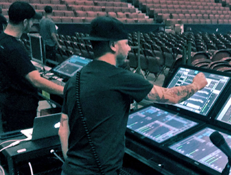Will Madera (foreground, with hat) and Gabriel Gil, using Waves eMotion LV1 mixing consoles.