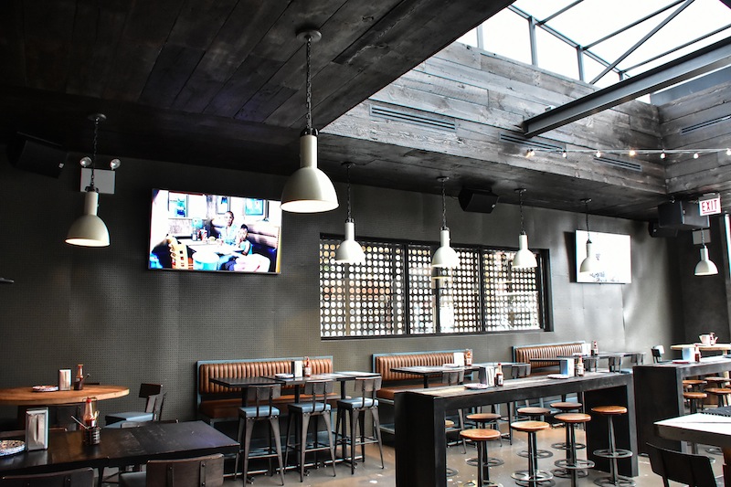 The club didn’t want anything obstructing the sky view when the retractable roof was open, so the speakers and subwoofers are mounted under the eaves.