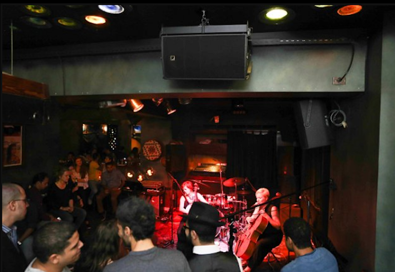 Two SB18i subs reinforce the low-frequencies and are placed on the ground, while two ARCS Wide speakers cover the larger areas just outside the dance floor.