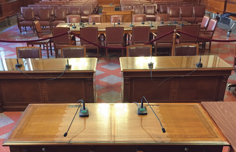 The chambers of the Pittsburgh City Council, featuring recently-installed Dante-networked Audio-Technica ATND8677 microphone desk stands with Engineered Sound conference microphones.