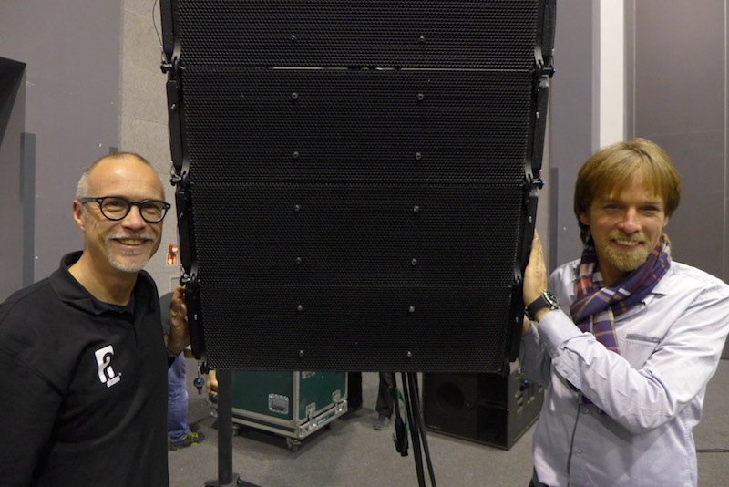 Tom Back of Alcons Audio and Grzegorz Fotek of Aplauz Poland, flanking the LR18 pro-ribbon line-array.
