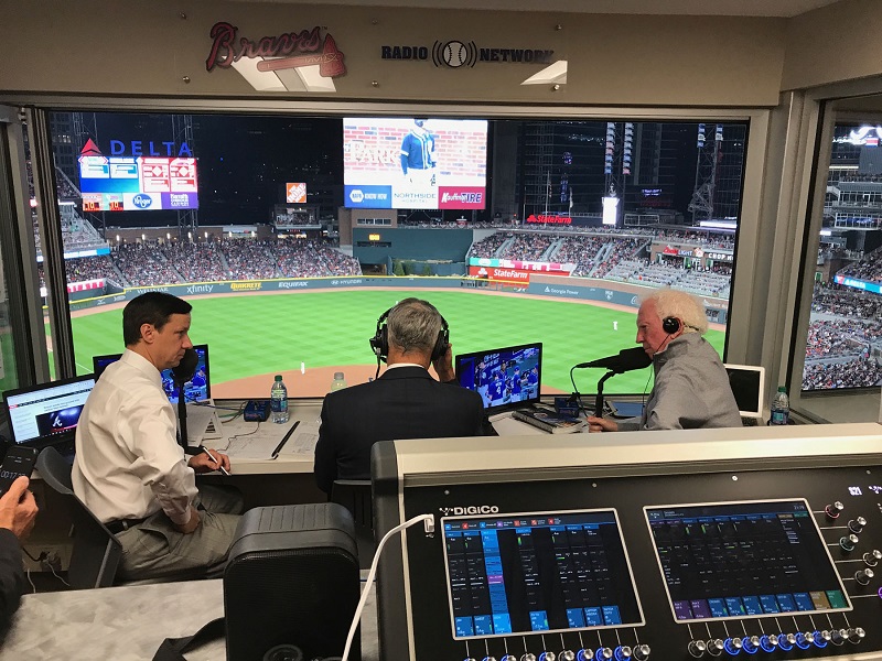 Atlanta Braves Radio Broadcasters Jim Powell (left) and Don Sutton (right) speaking with MLB Commissioner Rob Manfred (center) over the Braves’ 135-station regional radio network, operated by DBC