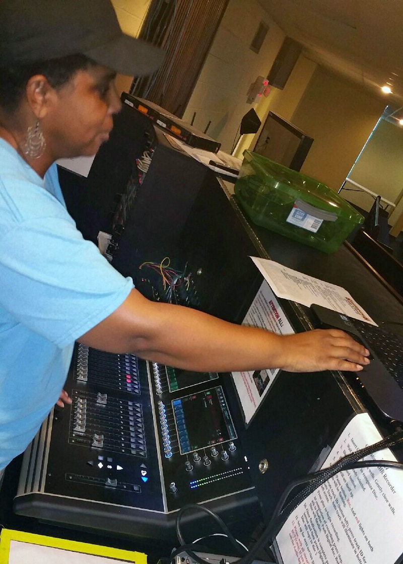 Marcia Danielson, lead volunteer for WCCI's video graphics and media team, operating the new DiGiCo S21 in the Chapel
