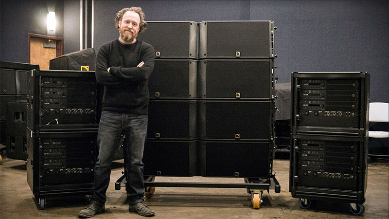 Nomad Sound COO and Majority Owner Damon Lange with a few of his new L-Acoustics K2 enclosures and LA-RAK IIs