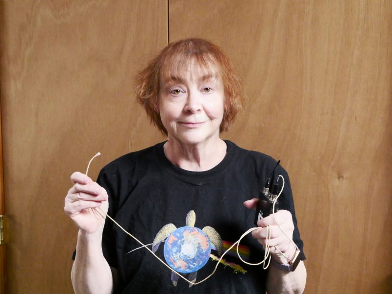 Anne Booker-Grogan with a Countryman B3 Omnidirectional Lavalier microphone.