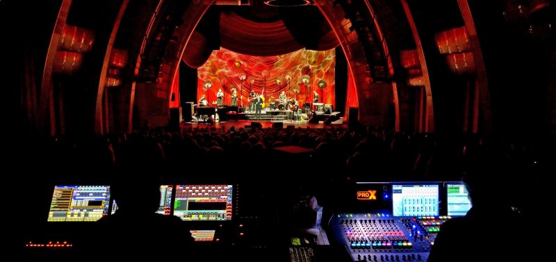 kd lang performing on stage and David Rahn (Alcons Audio USA / left) + Gary Stokes (kd lang FOH engineer / right).