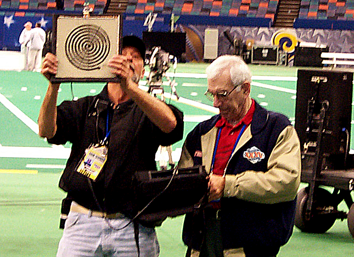 Sullivan — shown here where he loved to be — at a pre-show RF check before a Super Bowl game.