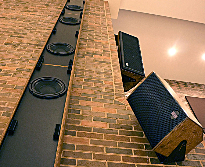 Perspective shot looking up at stage right P.A., with the custom Bag End bass column, Bag End Crystal2-I mid-high speaker (pointed towards the audience) and one of the Bag End CDS-110s (pointed at the side areas)