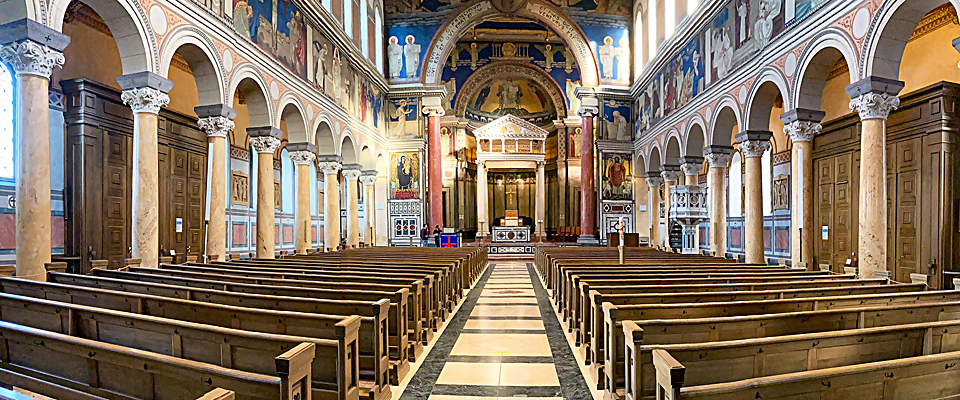 Designed in the style of an early Christian basilica, nearly every surface is covered with gorgeous mosaics and frescoes of famous biblical figures and events.