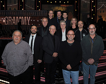 Pictured L-R: top row: Mikael Stewart, FOH Production Mixer; Andres Arango, Head Stage Monitor Tech/ATK Audiotek Project Manager; Jeff Peterson, System Designer, ATK Audiotek. Second row from top: Doug Mountain, Academy Consulting Engineer; Maureen Droney, P&E Wing Senior Executive Director. Third row from top: Leslie Ann Jones, GRAMMY Award Supervisor of FOH Audio; Glenn Lorbecki, GRAMMY Award Telecast Supervisor of Broadcast Audio. Second row from bottom: BJ Ramone, son of the late legendary producer Phil Ramone; Hank Neuberger, GRAMMY Award Telecast Supervisor of Broadcast Audio. Bottom row: Eric Schilling, Co-Broadcast Music Mixer; John Harris, Co-Broadcast Music Mixer; Ron Reaves, FOH Music Mixer. Photograph courtesy of The Recording Academy/WireImage. © 2014.