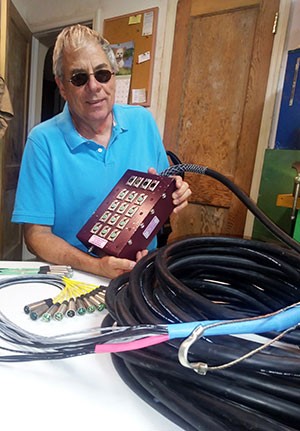Tom Muccio is pictured in his workshop with his Sommer Cable snake. Photo by Susan Muccio.